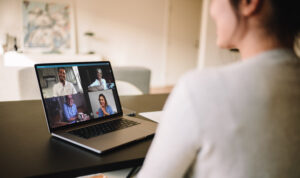 Woman having a video conference with friends. Family meeting online over a video call. Communications Support.