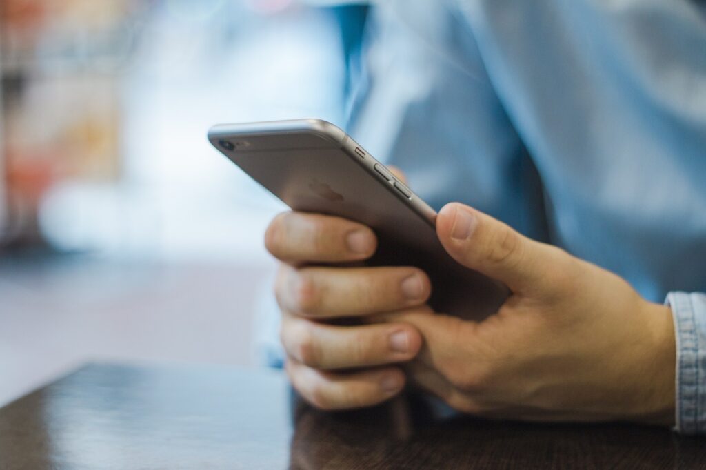 Man holding apple smart phone