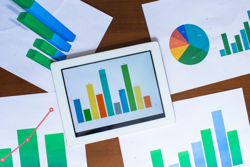 Business chart showing financial success on paper at the table